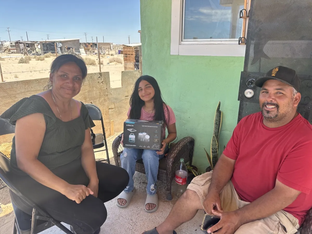 Family receiving a BioLite solar lighting kit