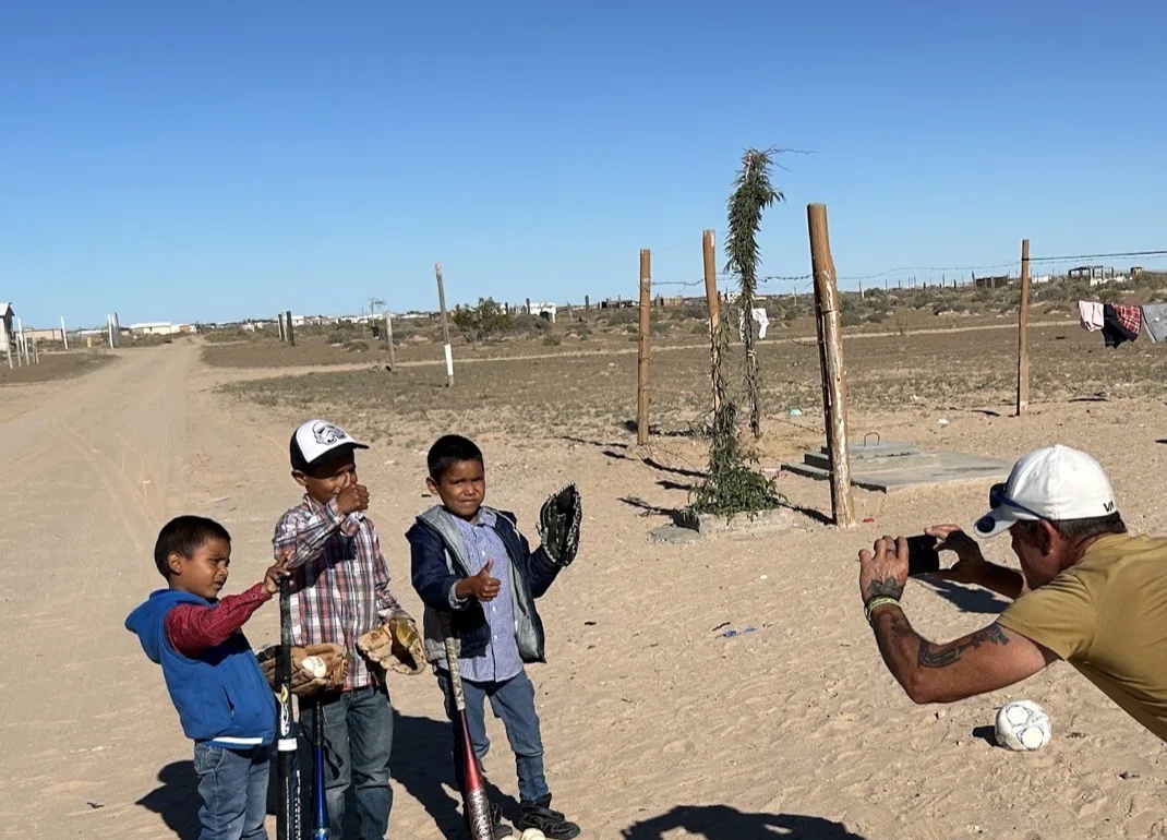 Kids in the community with baseball equipment