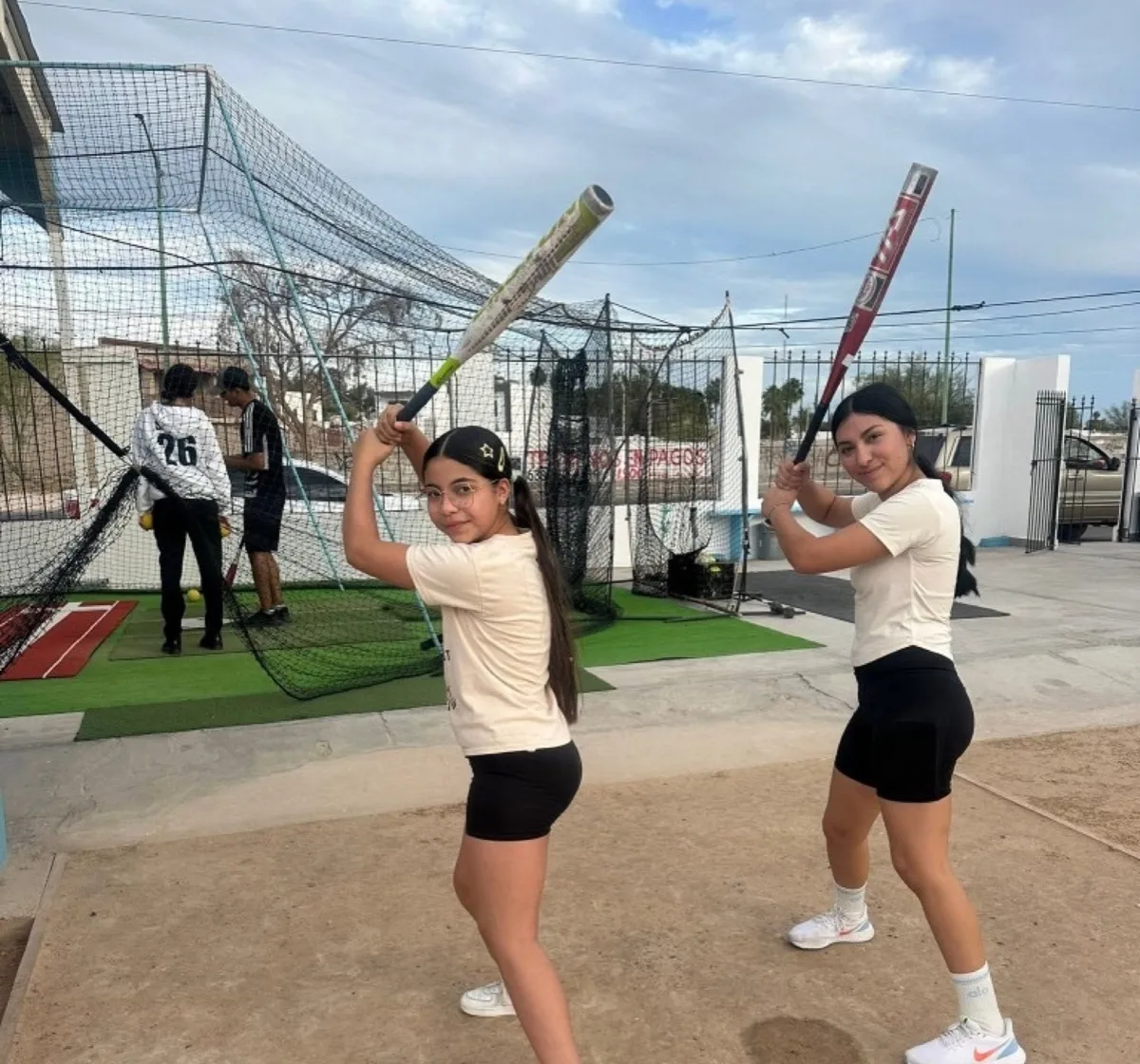 Kids practicing batting at a sports program in Puerto Peñasco